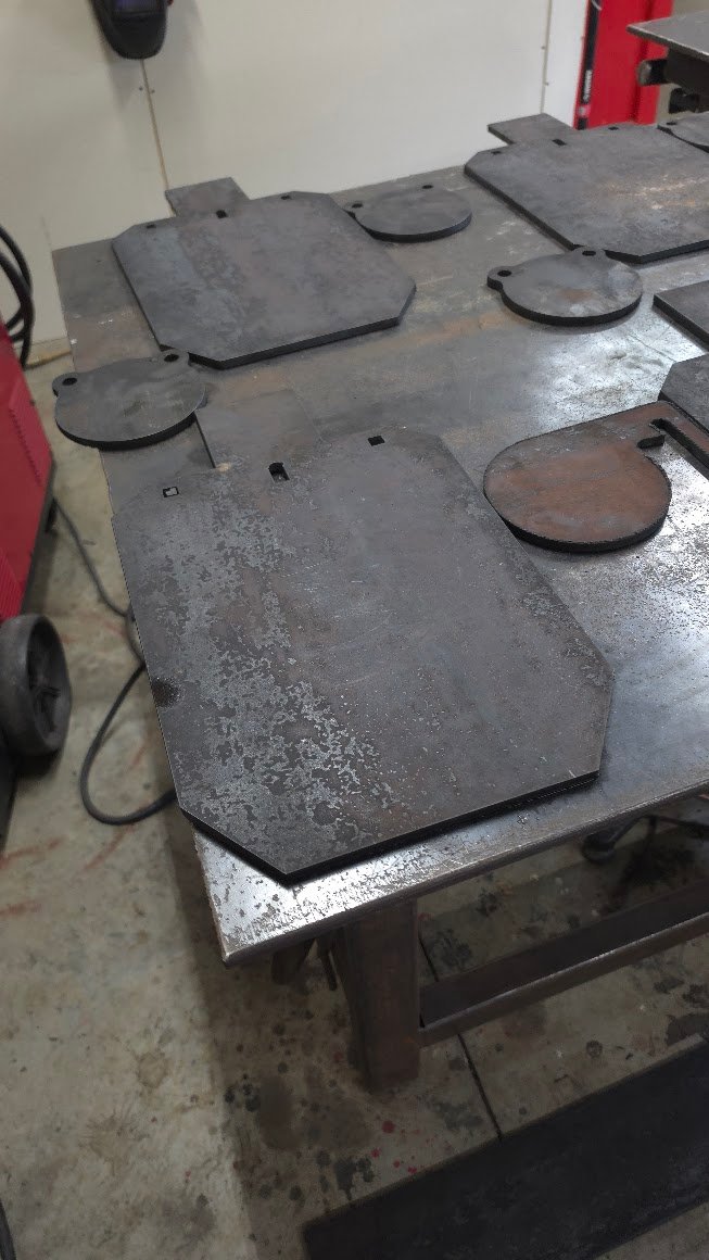 bulk Unfinished SR500 steel targets in production at Dead Center Fabrication, cut and prepared for final finishing and customer orders